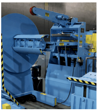Coil processing equipment by Colt Automation. Seen here: uncoiler, fixed coil car, hold down arm, dekinker, chute, peeler/threader, straightener.