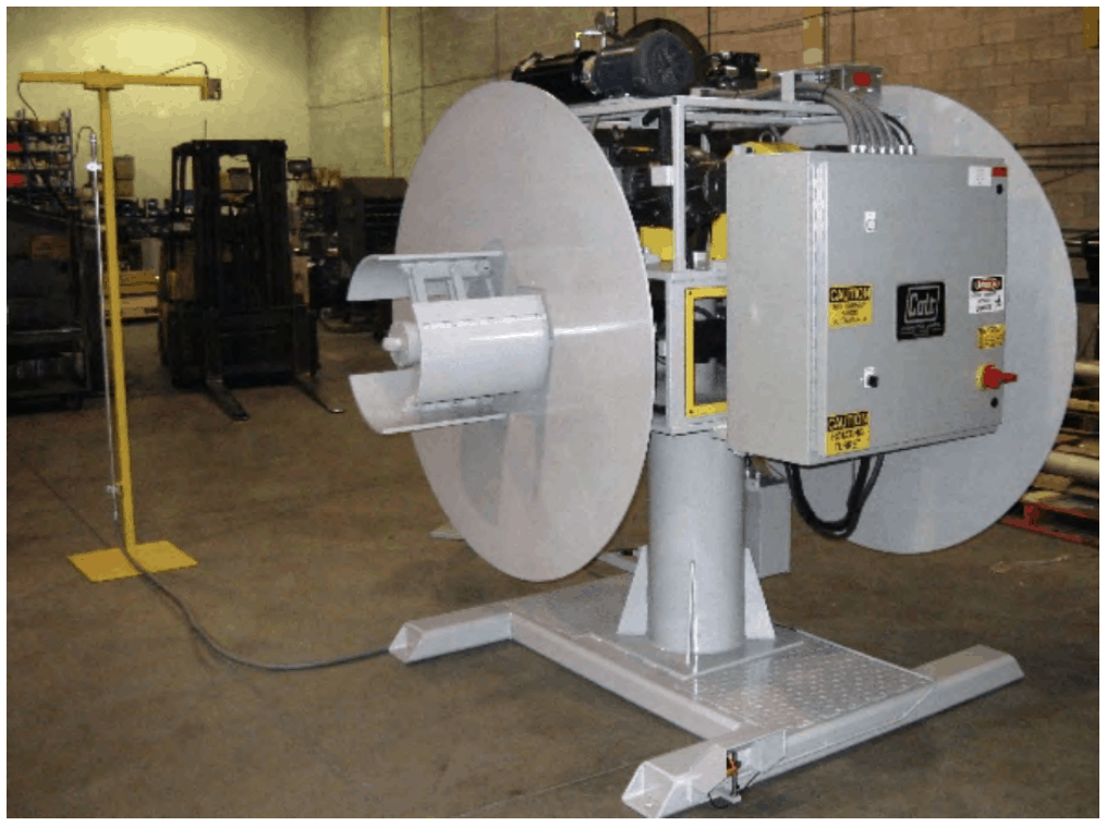 Colt Automation zig zag feeder for coil processing. Feeds the steel coil into press line.