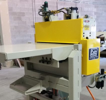 Colt Automation Feeder connecting to a press line for steel auto parts. Manual telescoping.